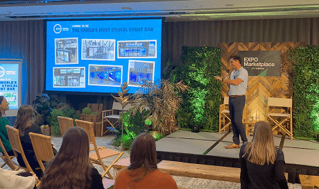 Our founder Randy Rampersad presenting the Better World Bar Hire story on a nature inspired stage to event professionals at the Micebook Expo in London