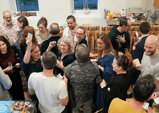 A crowd of guests celebrating together at the B Lab 10th birthday