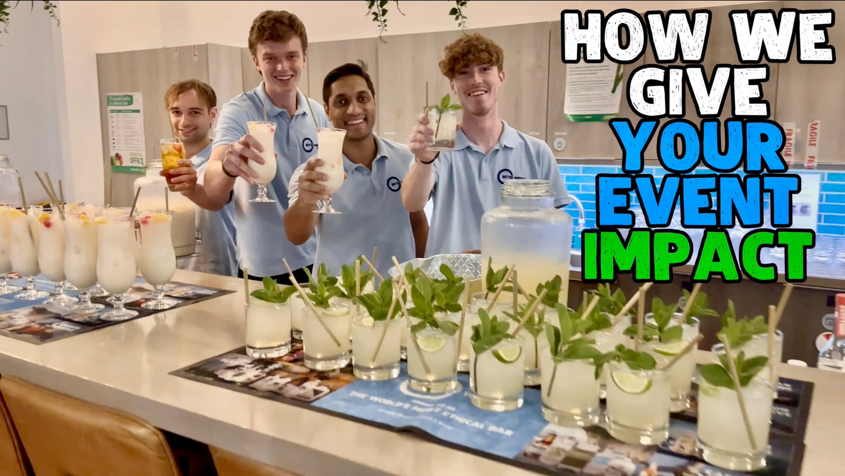 Video thumbnail titled How We Give Your Event Impact — four Better World Bar Hire team members in branded polo shirts raising fresh cocktails behind an office event bar lined with pina coladas and mint and lime highballs