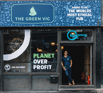The Green Vic pub in Shoreditch with Planet Over Profit painted across its window