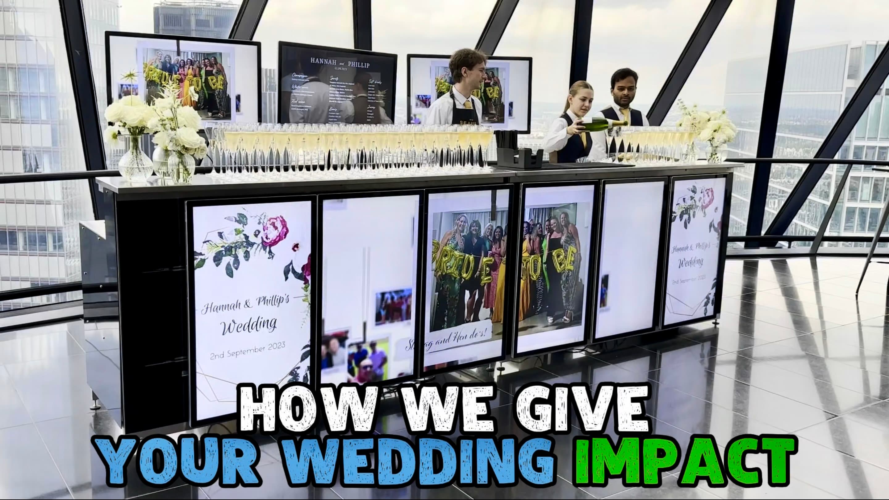 Video thumbnail titled How We Give Your Wedding Impact — the luxury digital wedding bar at The Gherkin, its screens showing Hannah and Phillip's wedding photos, with rows of filled champagne flutes, white roses and staff pouring champagne above the London skyline